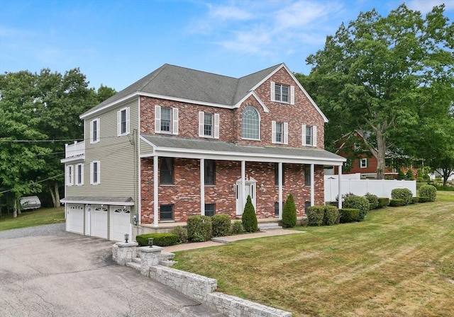 2 Dana Dr, Groveland, MA 01834 - view of front of house with a garage, driveway, roof with shingles, and brick siding