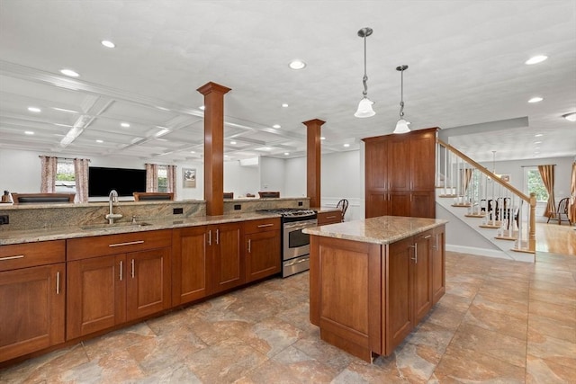 2 Dana Dr, Groveland, MA 01834 - kitchen featuring gas range, ornate columns, a sink, brown cabinets, and recessed lighting