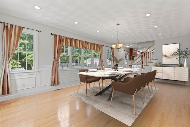 2 Dana Dr, Groveland, MA 01834 - dining space with a chandelier, recessed lighting, light wood-style floors, stairway, and a wainscoted wall