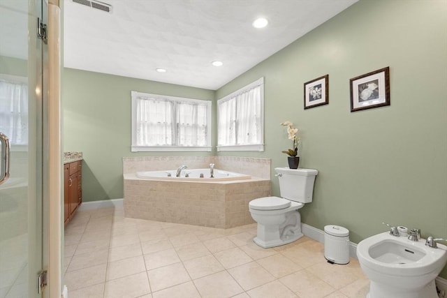 2 Dana Dr, Groveland, MA 01834 - bathroom featuring a bidet, a bath, toilet, tile patterned floors, and vanity