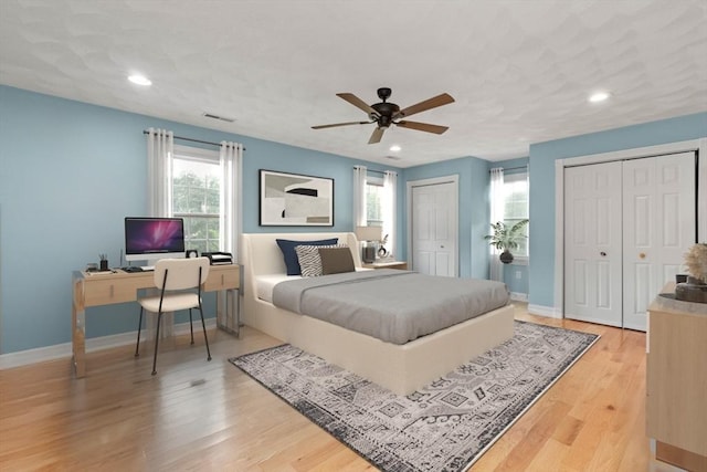 2 Dana Dr, Groveland, MA 01834 - bedroom with two closets, a desk, light wood-style floors, recessed lighting, and baseboards