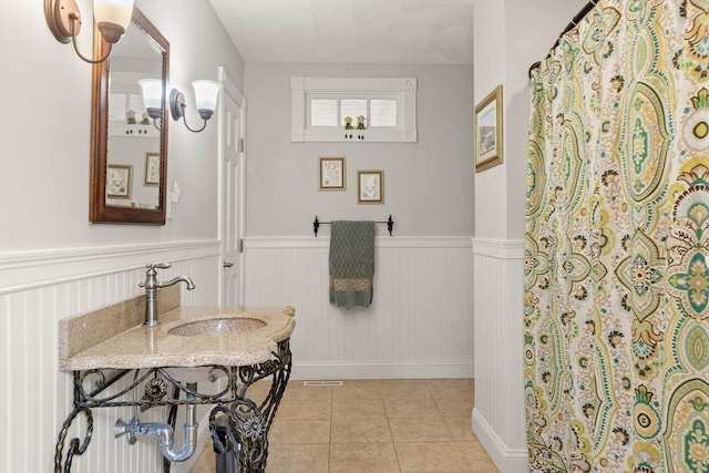 2 Dana Dr, Groveland, MA 01834 - full bathroom featuring a wainscoted wall, tile patterned flooring, a sink, and a shower with shower curtain