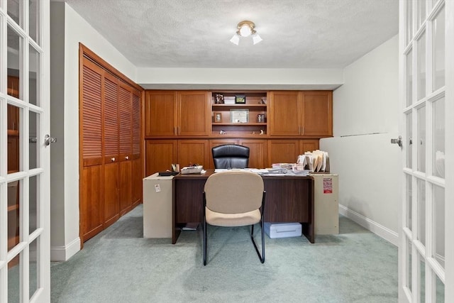 2 Dana Dr, Groveland, MA 01834 - home office with french doors, light colored carpet, a textured ceiling, and baseboards