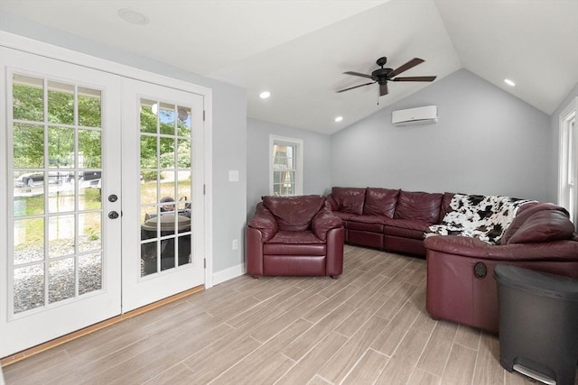 2 Dana Dr, Groveland, MA 01834 - living area with a wall mounted AC, french doors, lofted ceiling, light wood-style floors, and ceiling fan