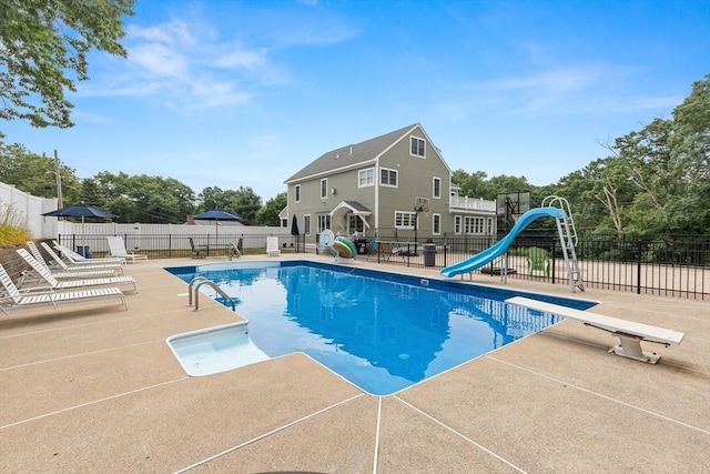 2 Dana Dr, Groveland, MA 01834 - view of pool with a water slide, a patio area, and a diving board