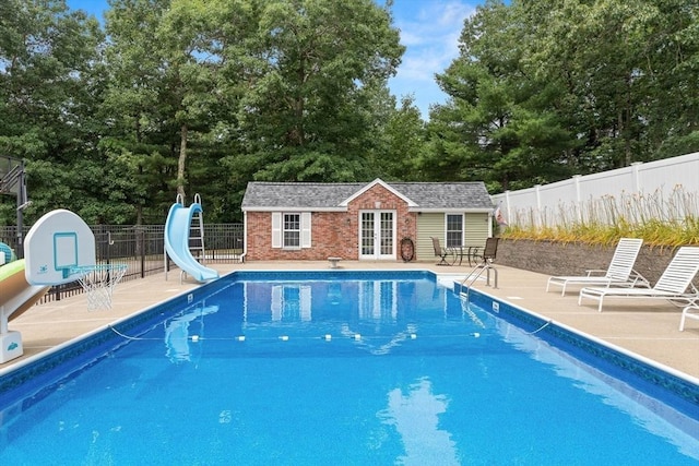 2 Dana Dr, Groveland, MA 01834 - view of pool with a water slide, a patio area, an outdoor structure, and view of scattered trees