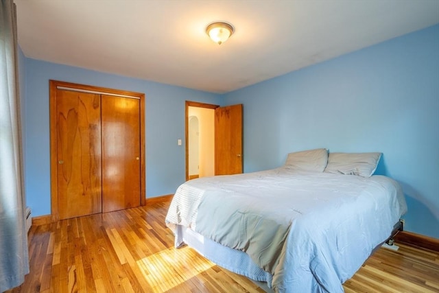60 Highland Ave, Leominster, MA 01453 - bedroom featuring baseboards, wood finished floors, and a closet