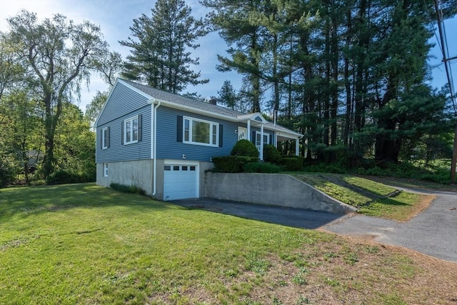 60 Highland Ave, Leominster, MA 01453 - single story home with driveway, a front lawn, and an attached garage