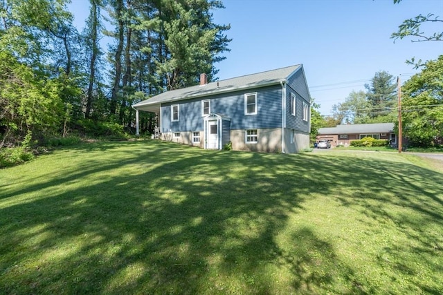 60 Highland Ave, Leominster, MA 01453 - rear view of property featuring a lawn and a chimney