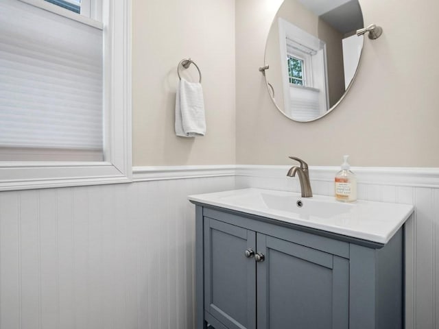 83 Boynton St, Waltham, MA 02453 - bathroom with wainscoting and vanity