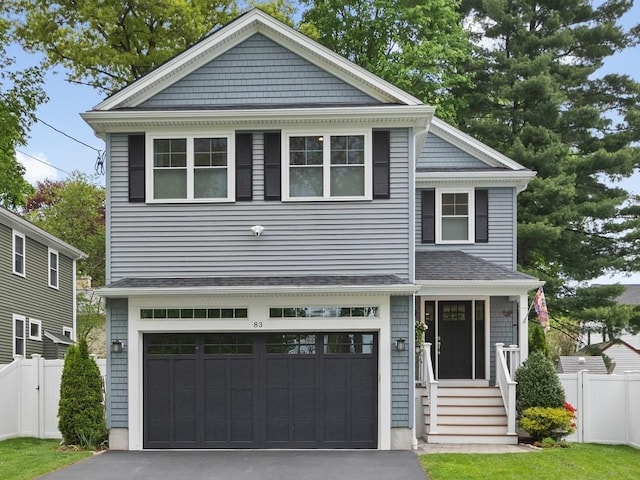 83 Boynton St, Waltham, MA 02453 - view of front of property with fence, asphalt driveway, a garage, and a shingled roof