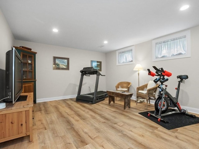 83 Boynton St, Waltham, MA 02453 - workout room with light wood-type flooring, recessed lighting, and baseboards