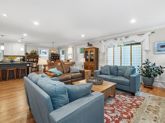 83 Boynton St, Waltham, MA 02453 - living room with crown molding, light wood-style flooring, and recessed lighting