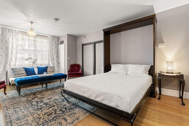 42 8th St Unit 4106, Boston, MA 02129 - bedroom with a closet, wood finished floors, and baseboards