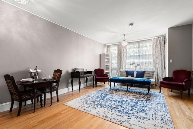 42 8th St Unit 4106, Boston, MA 02129 - living room featuring wood finished floors, baseboards, and a chandelier
