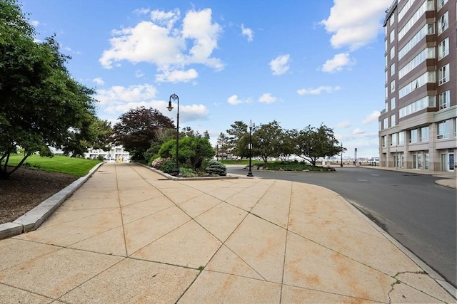42 8th St Unit 4106, Boston, MA 02129 - view of asphalt road featuring street lights and curbs
