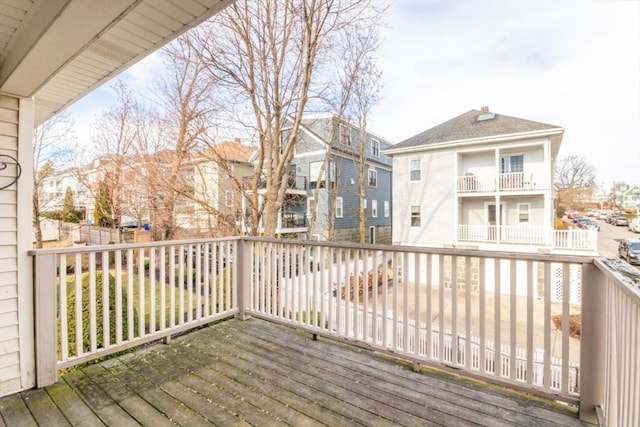 wooden deck featuring a residential view