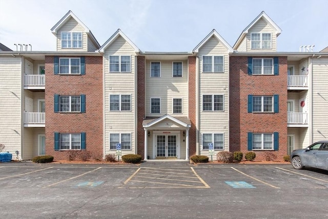 view of property featuring uncovered parking