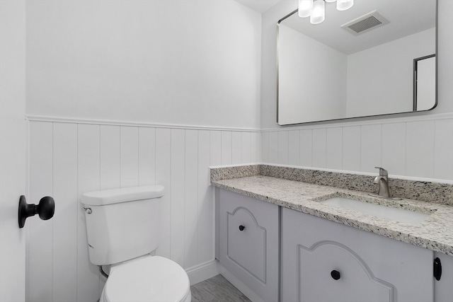 bathroom with vanity and toilet