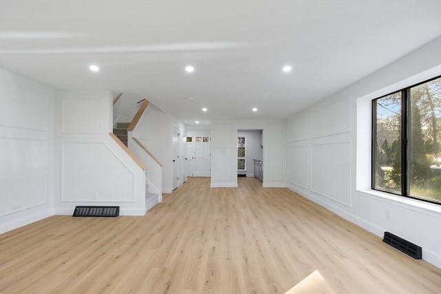 unfurnished living room featuring light hardwood / wood-style flooring