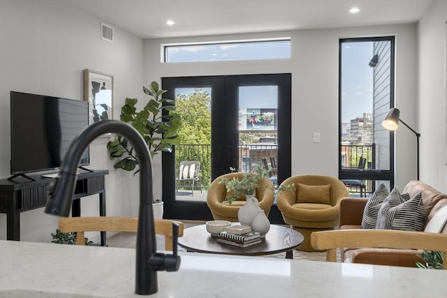100 Lincoln St Unit 303, Boston, MA 02135 - workout area with recessed lighting and french doors