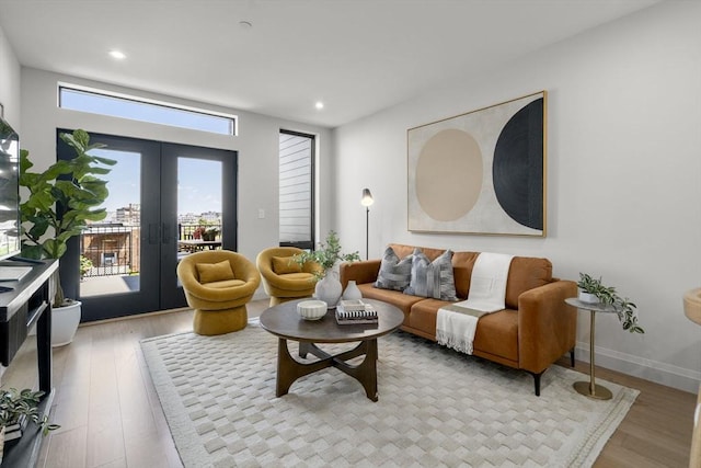 100 Lincoln St Unit 303, Boston, MA 02135 - living room featuring french doors, light wood-style flooring, and recessed lighting