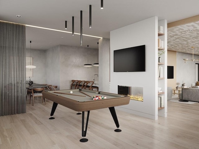 100 Lincoln St Unit 303, Boston, MA 02135 - recreation room with wood finished floors, billiards, and a multi sided fireplace