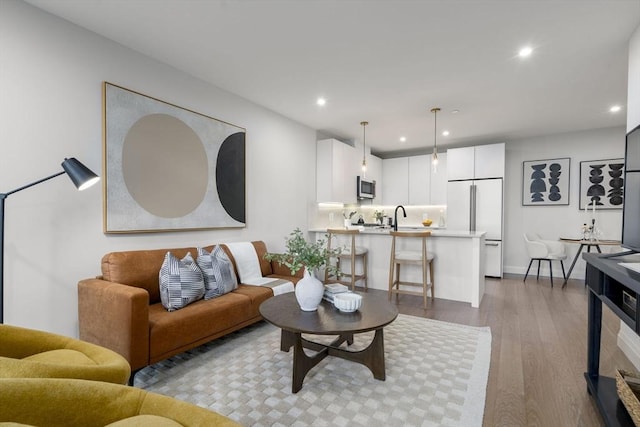 100 Lincoln St Unit 303, Boston, MA 02135 - living room featuring wood finished floors and recessed lighting