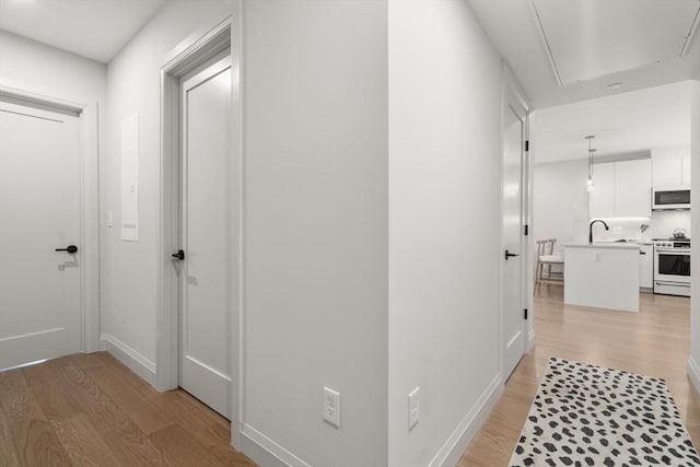100 Lincoln St Unit 303, Boston, MA 02135 - hallway with attic access and light wood-style flooring