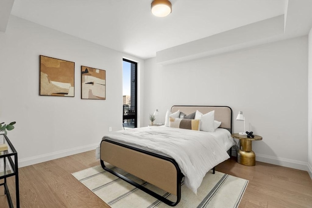 100 Lincoln St Unit 303, Boston, MA 02135 - bedroom featuring light wood-style flooring and baseboards