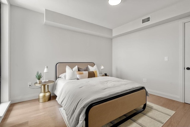 100 Lincoln St Unit 303, Boston, MA 02135 - bedroom featuring light wood-type flooring and baseboards