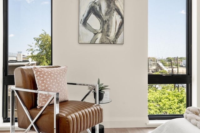 100 Lincoln St Unit 303, Boston, MA 02135 - living area with plenty of natural light and wood finished floors