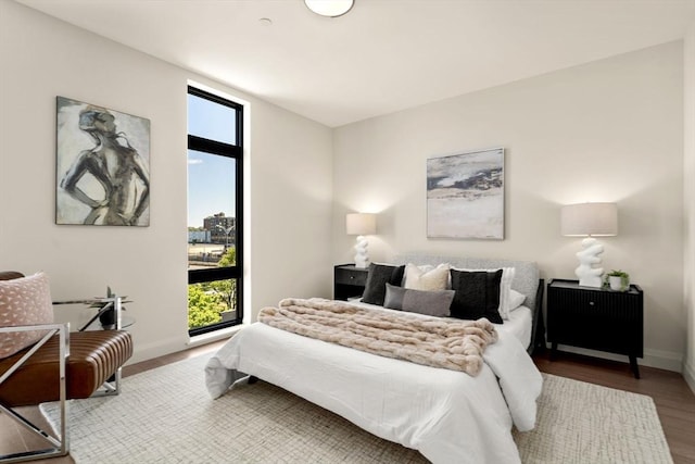 100 Lincoln St Unit 303, Boston, MA 02135 - bedroom with baseboards and wood finished floors