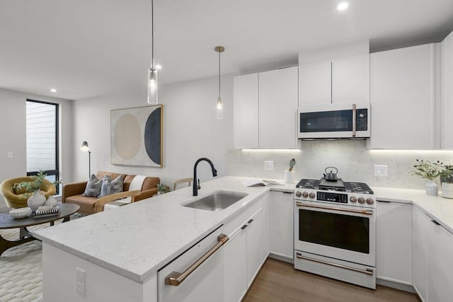 100 Lincoln St Unit 303, Boston, MA 02135 - kitchen featuring white appliances, a peninsula, white cabinetry, decorative backsplash, and light stone countertops