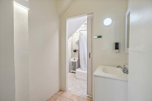 full bath with curtained shower, tile patterned flooring, and vanity