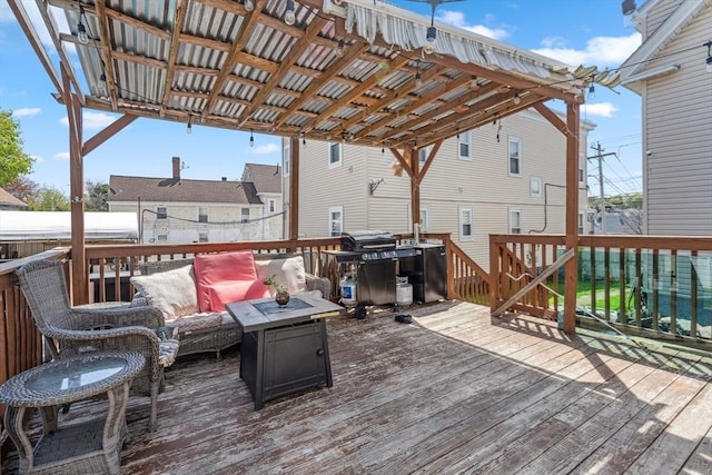 wooden terrace with a grill