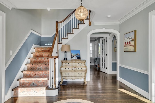 115 Rutledge, Belmont, MA 02478 - stairs with arched walkways, wood finished floors, ornamental molding, baseboards, and a chandelier