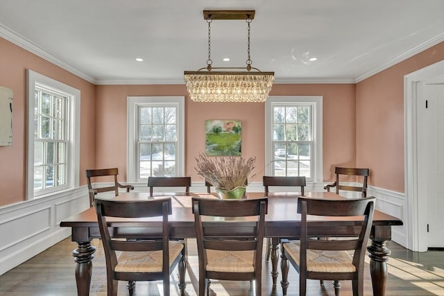 115 Rutledge, Belmont, MA 02478 - dining room featuring dark wood-type flooring, a chandelier, wainscoting, crown molding, and a decorative wall