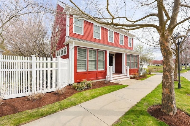 view of front of house with fence