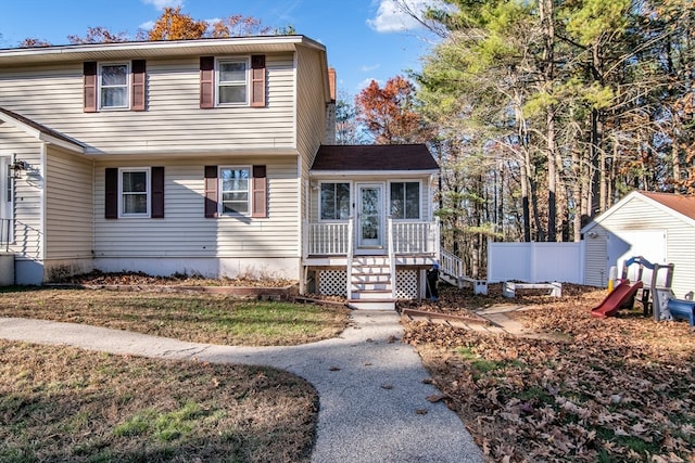 view of front of house featuring a shed