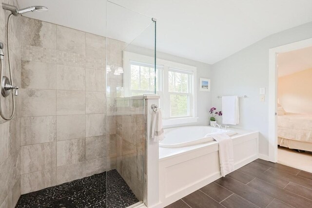 185 Read St, Seekonk, MA 02771 - full bathroom featuring connected bathroom, a stall shower, a garden tub, lofted ceiling, and wood finish floors