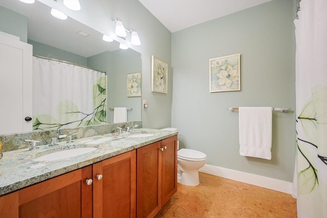 185 Read St, Seekonk, MA 02771 - full bath with speckle patterned floor, baseboards, double vanity, and toilet
