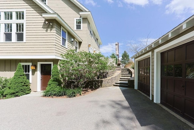 185 Read St, Seekonk, MA 02771 - view of side of home with stairs and a garage