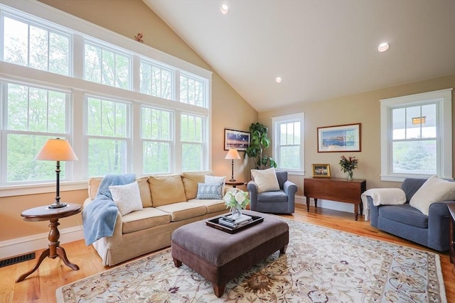185 Read St, Seekonk, MA 02771 - living room with lofted ceiling, wood finished floors, recessed lighting, and baseboards