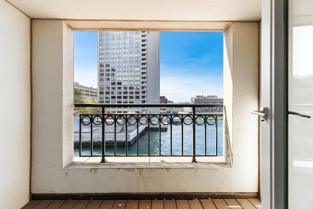 balcony with a city view and a water view