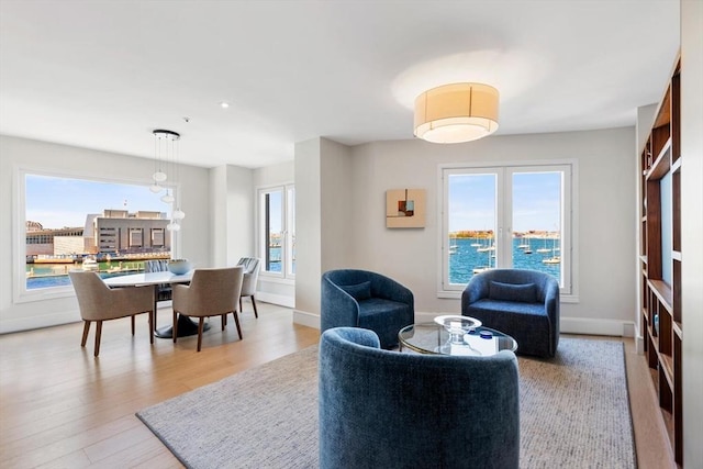 living room with light wood finished floors and baseboards
