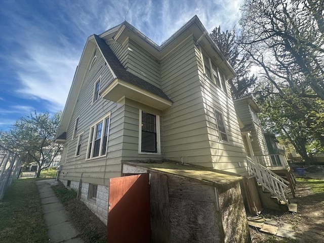 view of side of property with fence