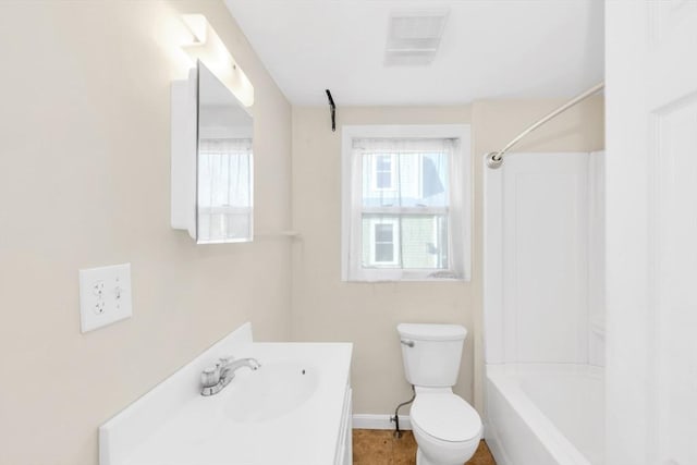 bathroom with vanity, baseboards, toilet, visible vents, and bathtub / shower combination