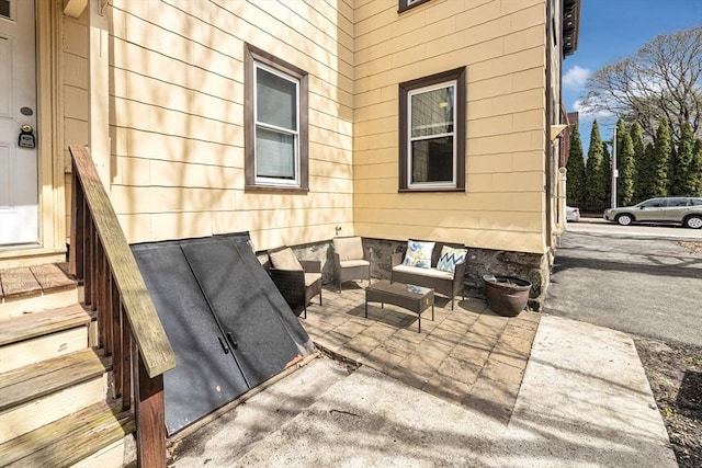 view of patio / terrace with an outdoor living space and entry steps