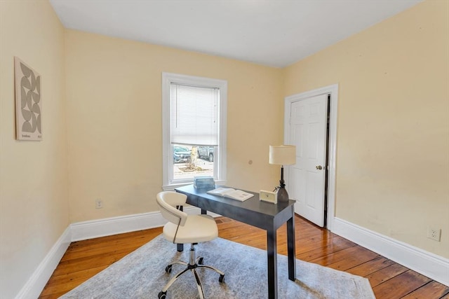 office space featuring wood-type flooring and baseboards